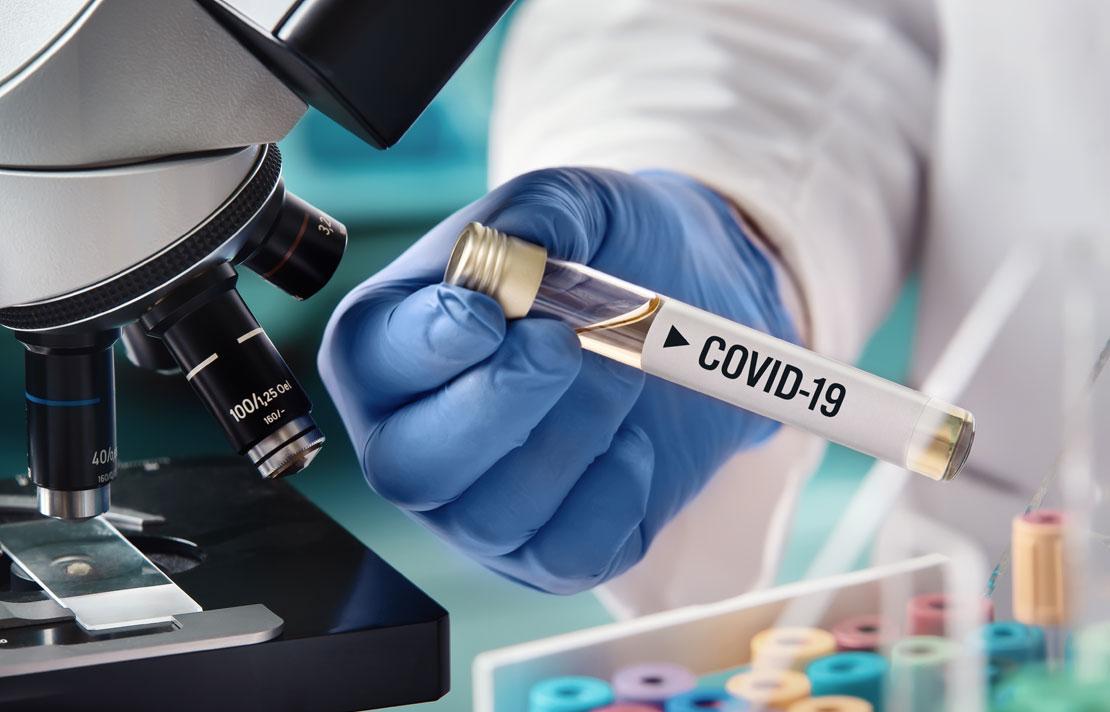 Fotografía, Tubo de ensayo con la palabra covid-19